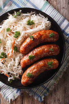 German bratwurst and sauerkraut on the table. vertical top view
