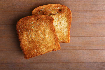 fragrant Toasts of white bread on wooden table