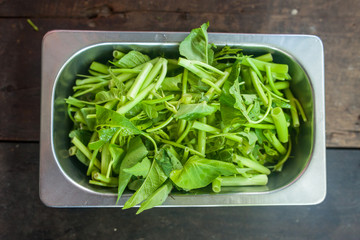 Chinese morning glory vegetable in the stainless cup ready for cooking