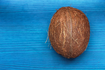 coconut on a blue wooden surface