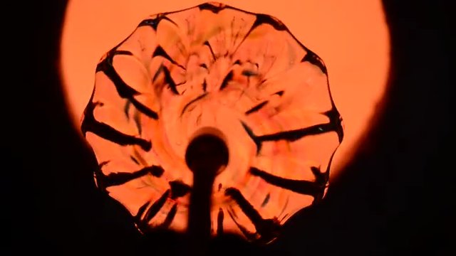 Blown glass comeing out of furnace