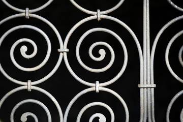 Ornamental spiral pattern of an old metal fence