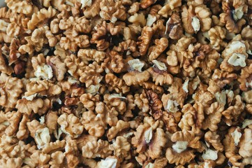 A pile of peeled English walnut. Natural background
