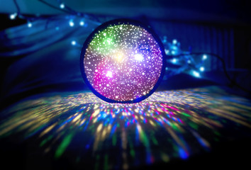 Bright ball of multicolored led lights in darkness