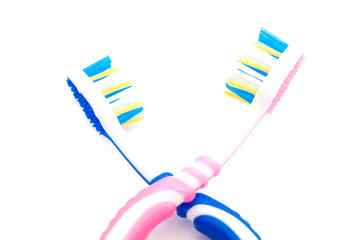 blue and pink toothbrushes