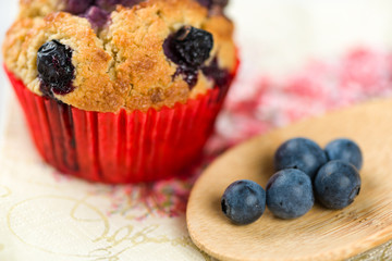 Blueberry cupcake with decoration on napkin