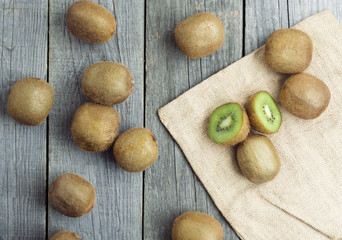 Juicy kiwi fruit on wooden background