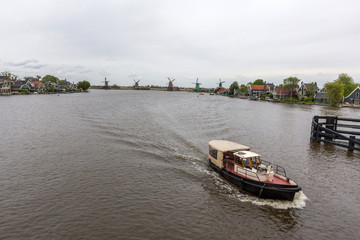 Fototapeta na wymiar A boat moving in Zaan river