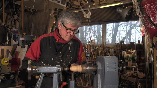 wood turner cutting shapes in wood