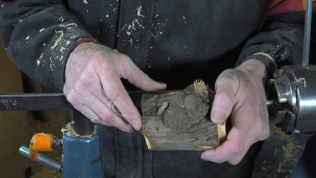 wood turner cutting shapes in wood