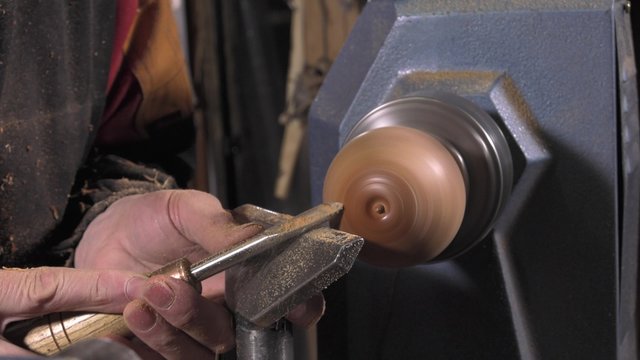 wood turner cutting shapes in wood