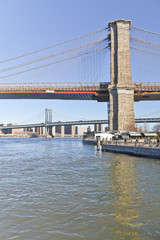 Fototapeta premium Brooklyn Bridge on winter morning with manhattan buildings in background.