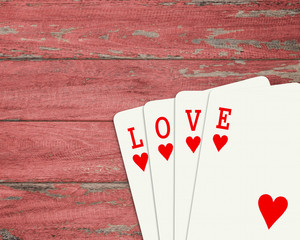Poker "Love" words put on wood background.