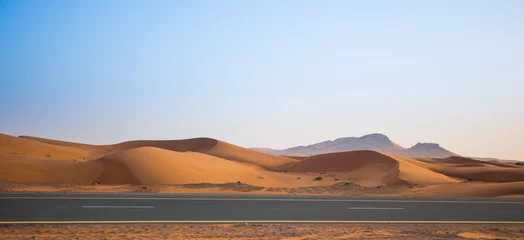 Zelfklevend Fotobehang desert, sand dunes and the road in the evening © oleg_mj