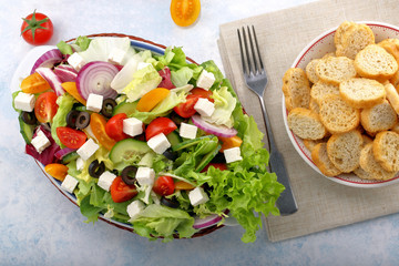 Greek salad with feta cheese black olives and bruscheta