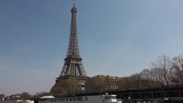 Eiffel Tower slow motion Seine River - vehicle shot. Eiffel Tower shot from a boat in the Seine river. Smooth slow motion vehicle shot - 1080p