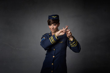 air hostess gesturing hashtag symbol