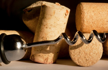 Selective focus wine corkscrew and corks.