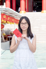 Asian lady holding red envelope or Ang-pow .