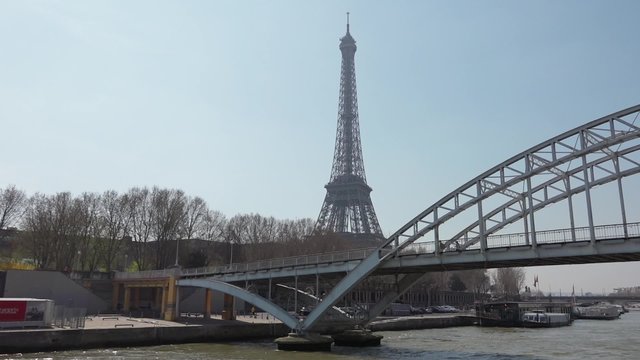 Eiffel Tower smooth vehicle shot - 60fps. Eiffel Tower shot from a boat in the Seine river. Smooth tracking shot - 1080p