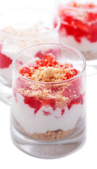 Cottage cheese dessert with strawberry jelly and cookies in a gl