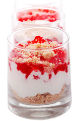 Cottage cheese dessert with strawberry jelly and cookies in a gl