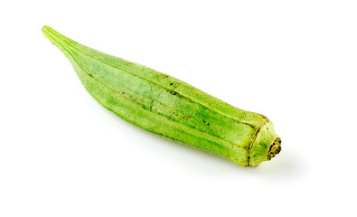 Macro of mature okra gumbo pod against white