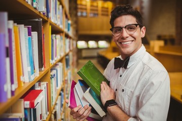 Portrait of nerd holding books