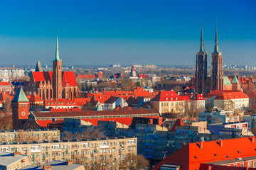 Obraz premium Aerial view of Ostrow Tumski with Cathedral of St. John and church of the Holy Cross and St. Bartholomew from St. Mary Magdalene Church in the morning in Wroclaw, Poland