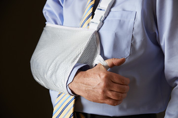 Close Up Of Businessman With Arm In Sling