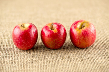 Macro of three apples with shallow depth of field