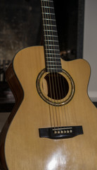 Fototapeta premium Guitar standing in front of fireplace