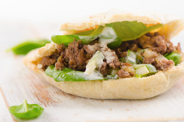 Homemade Pita bread with meat and fresh vegetables.