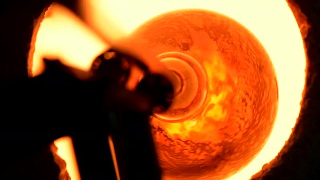 Blown glass comeing out of furnace