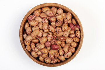 pinto beans on wood bowl 