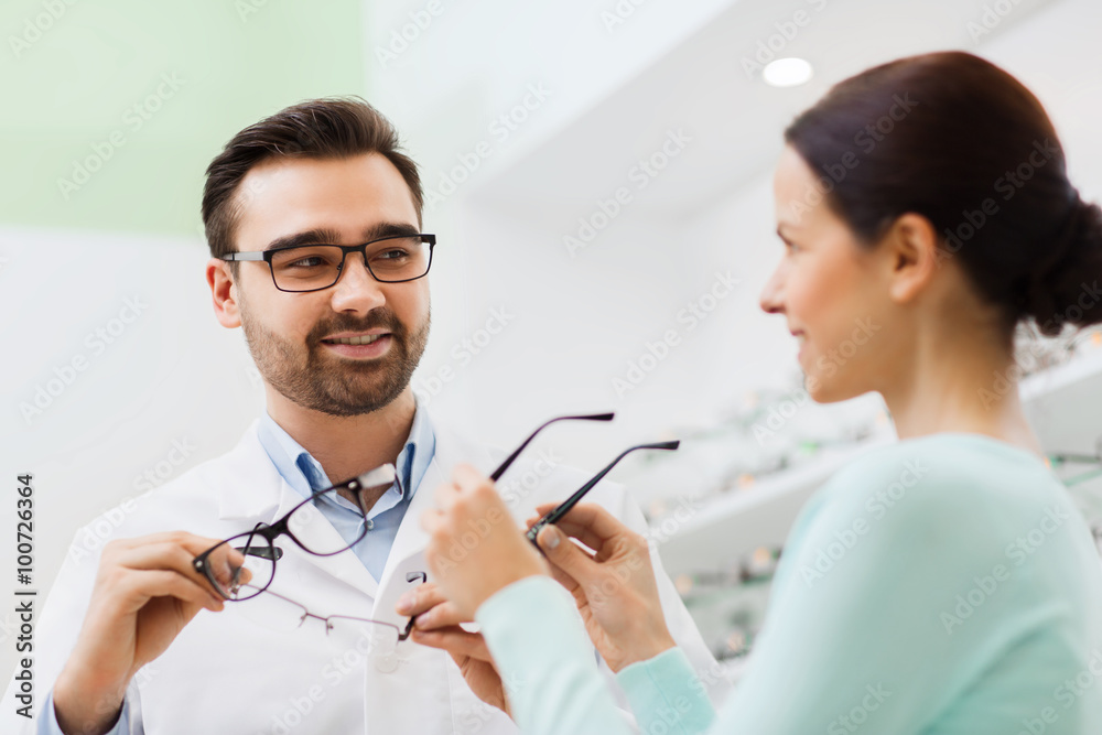 Canvas Prints woman and optician showing glasses at optics store