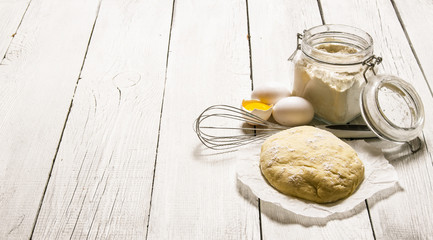 Preparation of the dough. The prepared dough with the ingredients - eggs, flour, sour cream and...