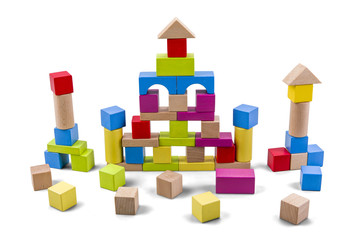 Wooden building castle of colorful blocks isolated on white with