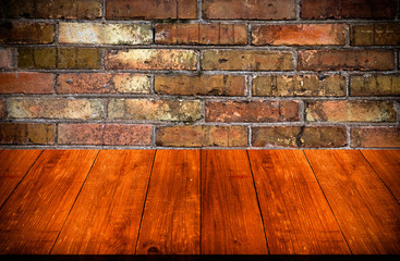 Red brick wall texture. Background. View from dark wooden gangwa