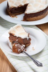 Fototapeta na wymiar Sweet cake with chocolate on a light wooden table