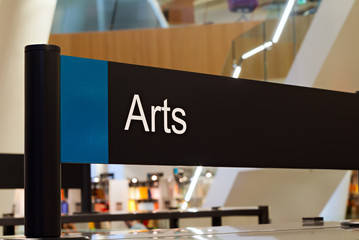 Arts section sign inside a modern public library