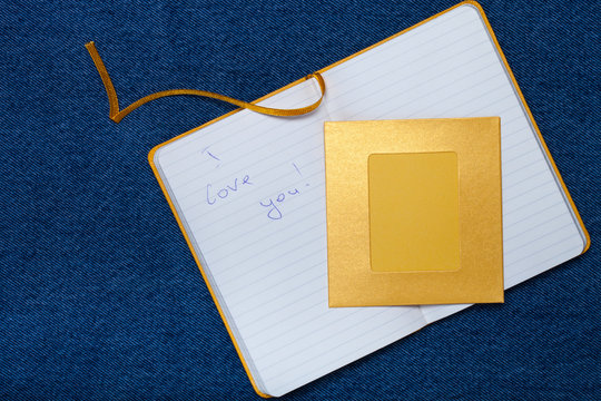 The inscription "I LOVE YOU" in notebook and space for text. Rom