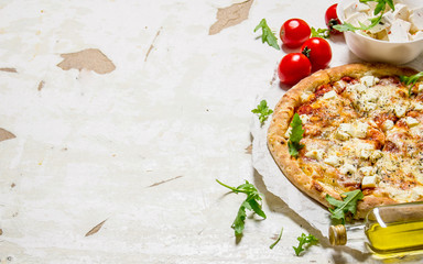 Cheese pizza with tomatoes and fresh cheese.