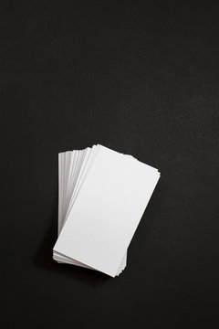 blank business cards stack up on Black background © tonefotografia