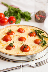 Traditional french quiche pie with salmon and cherry tomato