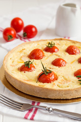 Traditional french quiche pie with salmon and cherry tomato