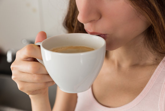 Woman drinking her morning coffee