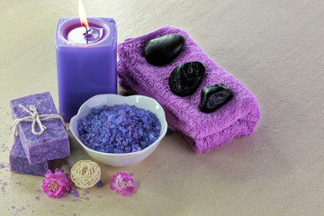 Obraz na płótnie Canvas Spa treatment setting with purple theme