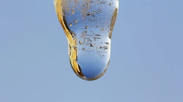 Close up of a melting icicle and dripping water