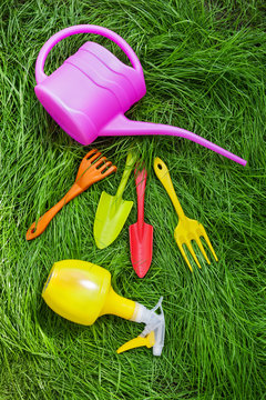 Garden tools on green grass